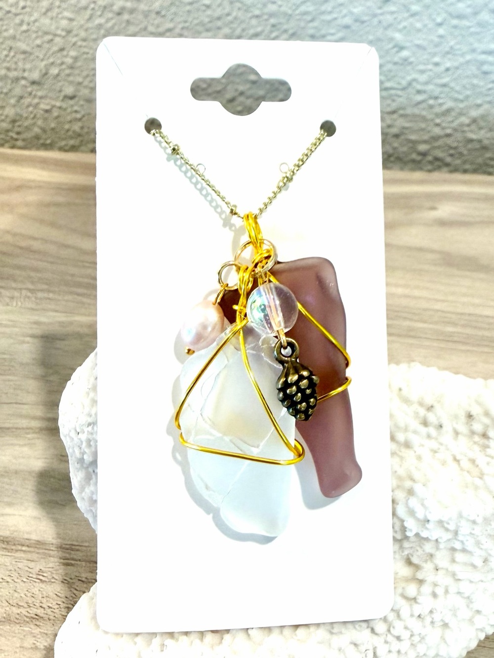 10. Gold-Wire Wrapped burgundy Sea Glass Pendant Necklace with pine cone charm